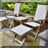 L02. Kingsley Bate teak patio chairs, ottomans and side table. 